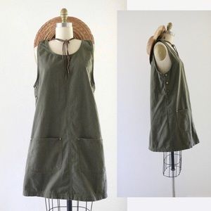 Green pinafore dress with pockets